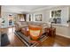 Cozy living room featuring hardwood floors, a sectional sofa, and ample natural light at 1100 Hudson St, Denver, CO 80220