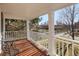 This home has a covered front porch with wooden floors and white railings at 1100 Hudson St, Denver, CO 80220