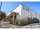 The Blanco Cocina + Cantina restaurant has a modern exterior of white tile and a covered entry at 1100 Hudson St, Denver, CO 80220