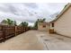 Spacious backyard with concrete patio, wooden fence, and view of detached garage at 3780 E 117Th Ave, Thornton, CO 80233