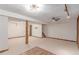 Spacious basement featuring rustic wood accents, modern lighting, and carpeted floors at 3780 E 117Th Ave, Thornton, CO 80233