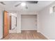 Basement bedroom with an open closet and a door leading to another room at 3780 E 117Th Ave, Thornton, CO 80233