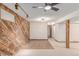 Finished basement with wood accent walls and carpet at 3780 E 117Th Ave, Thornton, CO 80233