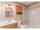 Bathroom featuring a shower-tub combo and vanity at 3780 E 117Th Ave, Thornton, CO 80233