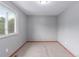 Empty bedroom with natural light, gray walls and carpet at 3780 E 117Th Ave, Thornton, CO 80233