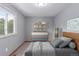 Cozy bedroom featuring a dresser, carpet, and natural light at 3780 E 117Th Ave, Thornton, CO 80233
