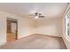 Spacious living area features carpeting, light walls, and a ceiling fan at 3780 E 117Th Ave, Thornton, CO 80233