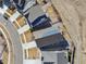 Aerial view of neighborhood showcasing home with solar panels and adjacent walking trail at 17097 W 87Th Ave, Arvada, CO 80007
