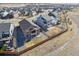 Aerial view of new construction homes in a suburban neighborhood, featuring fenced yards and walking paths at 17097 W 87Th Ave, Arvada, CO 80007
