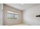 Bright bedroom features a large window offering natural light and a peaceful view at 17097 W 87Th Ave, Arvada, CO 80007