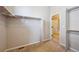 Spacious walk-in closet with carpet floors, white racks, and ample storage space at 17097 W 87Th Ave, Arvada, CO 80007