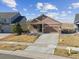 Charming single-Gathering home with stone accents and a well-manicured front yard at 17097 W 87Th Ave, Arvada, CO 80007