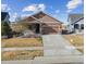 Charming single-Gathering home with stone accents and a well-manicured front yard at 17097 W 87Th Ave, Arvada, CO 80007
