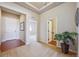 Inviting foyer featuring carpet and hardwood floors and an arched doorway at 17097 W 87Th Ave, Arvada, CO 80007