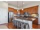 Modern kitchen with stainless steel appliances, granite countertops, and ample counter space at 17097 W 87Th Ave, Arvada, CO 80007