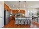 Bright eat-in kitchen featuring stainless steel appliances, granite countertops, and a center island with bar stool seating at 17097 W 87Th Ave, Arvada, CO 80007