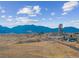 Beautiful landscape featuring mountains and open fields with distant city views at 17097 W 87Th Ave, Arvada, CO 80007