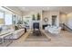Inviting living room features a cozy fireplace, comfortable seating, and ample natural light at 17097 W 87Th Ave, Arvada, CO 80007