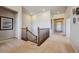 Bright staircase with wooden railings and carpeted steps, leading to the upper level at 17097 W 87Th Ave, Arvada, CO 80007