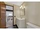 Cozy bathroom features a white sink, vanity, and standard toilet for basic needs at 2062 S Helena St # B, Aurora, CO 80013