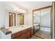 Bathroom with vanity featuring and sinks and expansive mirror at 2062 S Helena St # B, Aurora, CO 80013