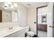 Bathroom featuring vanity, toilet, mirror, and shower at 2062 S Helena St # B, Aurora, CO 80013