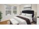 Comfortable bedroom featuring a large bed, soft lighting, and bright windows for a relaxing retreat at 2062 S Helena St # B, Aurora, CO 80013