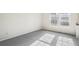 Light-filled bedroom featuring plush gray carpet and large windows at 2062 S Helena St # B, Aurora, CO 80013