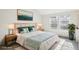 Bright bedroom with stylish decor, large windows, and natural lighting at 2062 S Helena St # B, Aurora, CO 80013