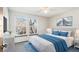 Bright bedroom with large windows, ceiling fan, carpeted floor, and modern decor at 2062 S Helena St # B, Aurora, CO 80013