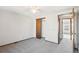 Cozy bedroom with carpet, fan, and natural light from the window; also features a closet with doors at 2062 S Helena St # B, Aurora, CO 80013