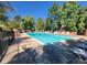 Inviting community pool surrounded by lush greenery, ideal for relaxation and recreation at 2062 S Helena St # B, Aurora, CO 80013