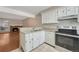 Kitchen featuring white cabinets, granite countertops, and stainless steel appliances at 2062 S Helena St # B, Aurora, CO 80013