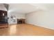 Bright living room featuring hardwood floors and a cozy brick fireplace at 2062 S Helena St # B, Aurora, CO 80013