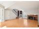 Spacious living room with hardwood floors and a brick fireplace at 2062 S Helena St # B, Aurora, CO 80013