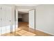 View from bedroom to the living room with hardwood floors at 2062 S Helena St # B, Aurora, CO 80013