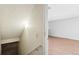 Staircase with light colored handrail leads to an upper level with light colored walls at 2062 S Helena St # B, Aurora, CO 80013