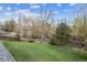 Green back yard with mature trees, with a view from the roof at 6609 W Mexico Pl, Lakewood, CO 80232
