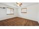 Comfortable bedroom with carpet and two windows bringing in natural light at 6609 W Mexico Pl, Lakewood, CO 80232