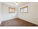 Bedroom with brown carpet, white walls, and natural light from the windows at 6609 W Mexico Pl, Lakewood, CO 80232