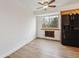 Eat-in kitchen with wood floors, natural lighting, and a modern refrigerator at 6609 W Mexico Pl, Lakewood, CO 80232