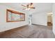 Bright living room with a bay window and neutral walls at 6609 W Mexico Pl, Lakewood, CO 80232