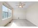 Neutral bedroom with a ceiling fan and ample natural light from a large window at 18897 E Linvale Pl, Aurora, CO 80013