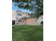 Charming two-story home featuring a lush green lawn, neutral siding, and a brick facade at 18897 E Linvale Pl, Aurora, CO 80013