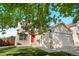 Inviting two-story home with a red door and a well-maintained lawn at 18897 E Linvale Pl, Aurora, CO 80013