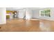 Bright living room features hardwood floors, lots of light, and entry to the kitchen and stairs at 18897 E Linvale Pl, Aurora, CO 80013