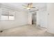 Cozy main bedroom with neutral carpet, ceiling fan, and an ensuite bathroom at 18897 E Linvale Pl, Aurora, CO 80013