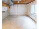 Unfinished basement with visible insulation, a small window, and open ceiling beams at 14608 E 52Nd Ave, Denver, CO 80239
