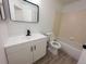 Bright bathroom featuring updated vanity, framed mirror, and a bathtub with tiled surround at 14608 E 52Nd Ave, Denver, CO 80239