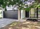 Charming single-story home featuring a dark two-car garage and cozy front entrance at 14608 E 52Nd Ave, Denver, CO 80239